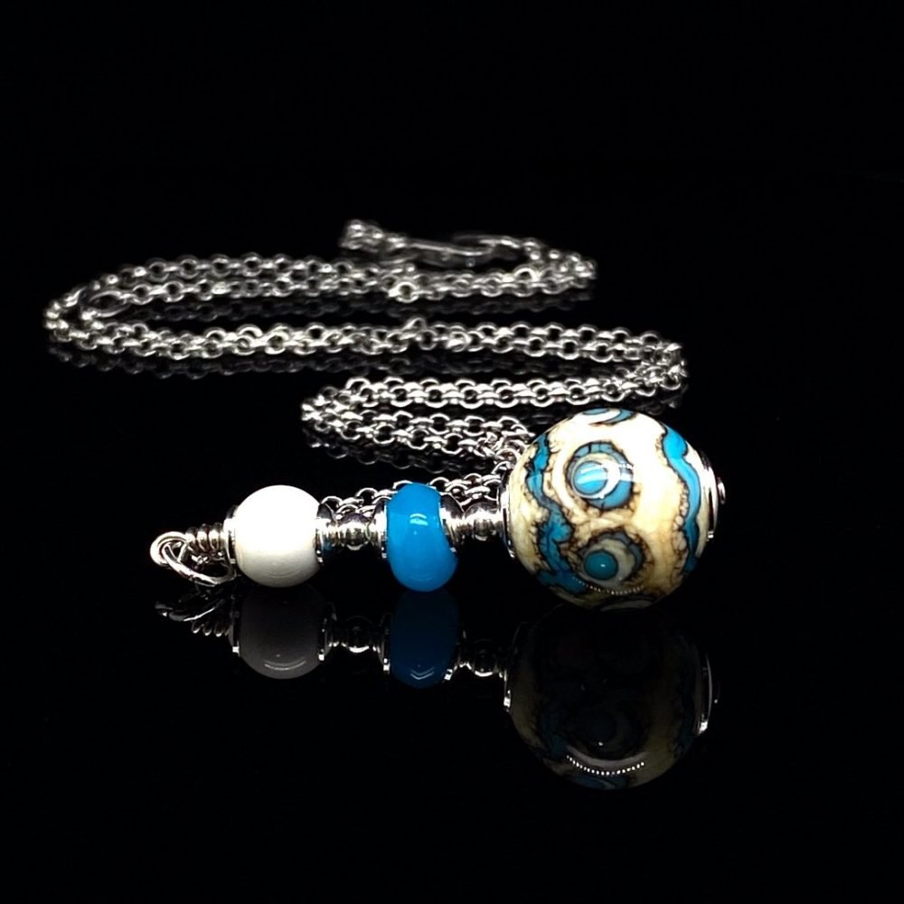 Ivory, Turquoise and Blue Murano Glass Pendant By Heidi Kjeldsen Jewellery on black