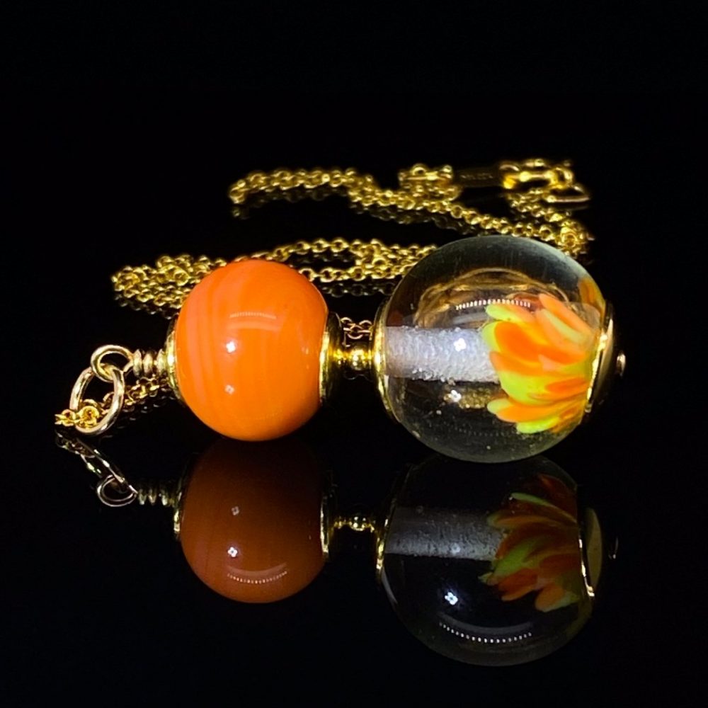 Stylish Orange Implosion Murano Glass Pendant By Heidi Kjeldsen Jewellers P1415 on black