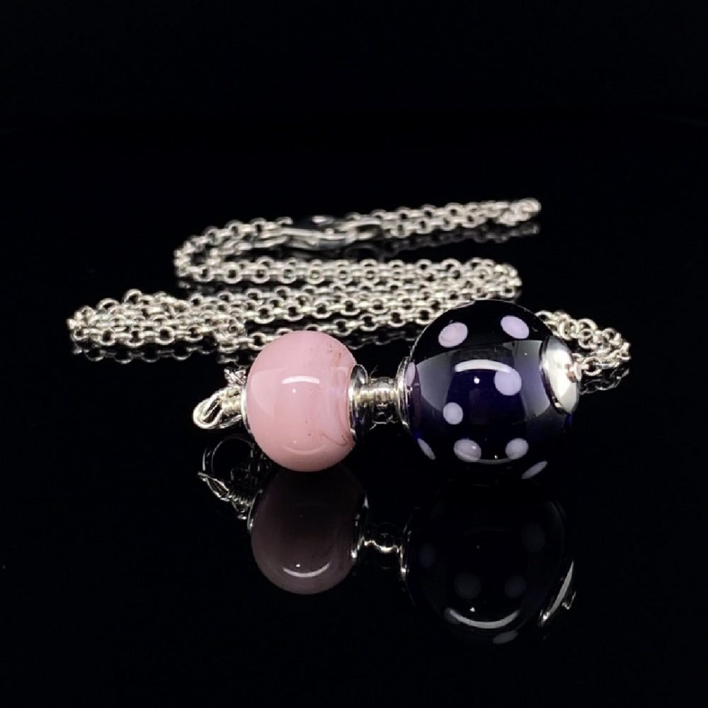 Pink and Purple Murano glass pendant by Heidi Kjeldsen Jewellery P1427 side view on black